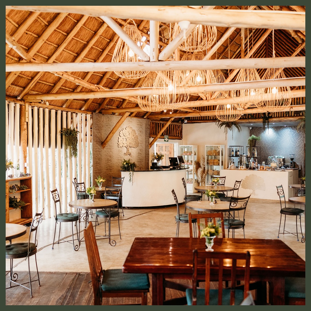 Interior of Luna's Restaurant with thatched timber A-frame and wooden tables