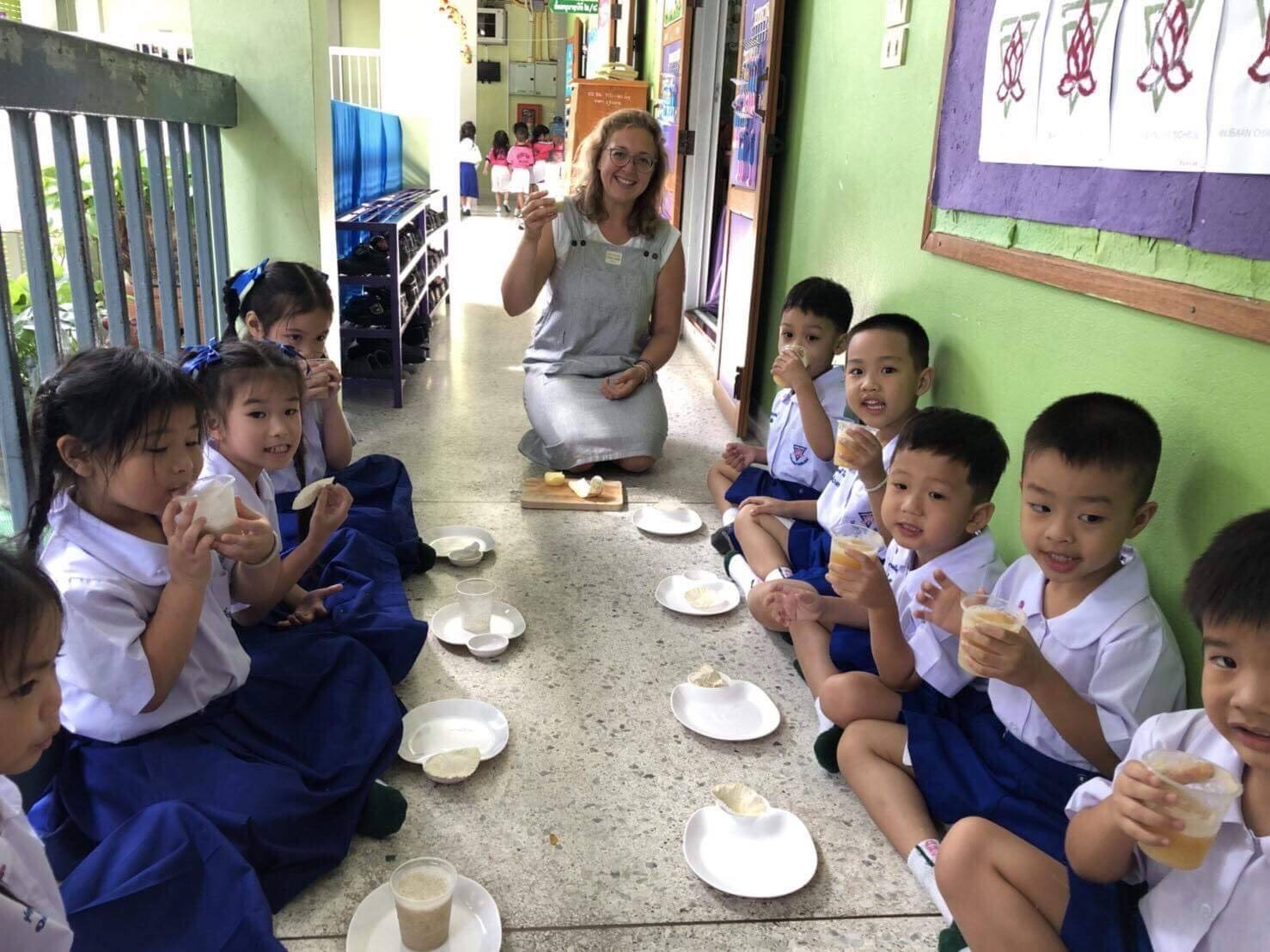 Expat English teacher with Thai children in a Chiang Mai school